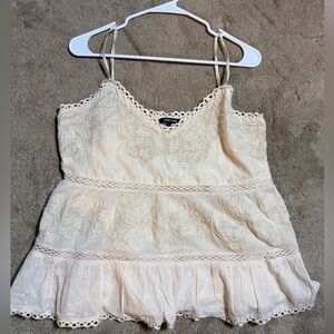 Love Sam lace peplum camisole top.
cream-colored